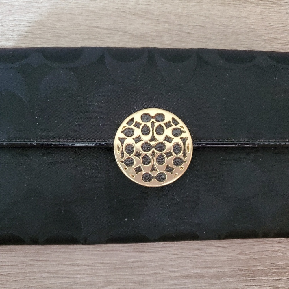 Black coach wallet with gold embellished latch